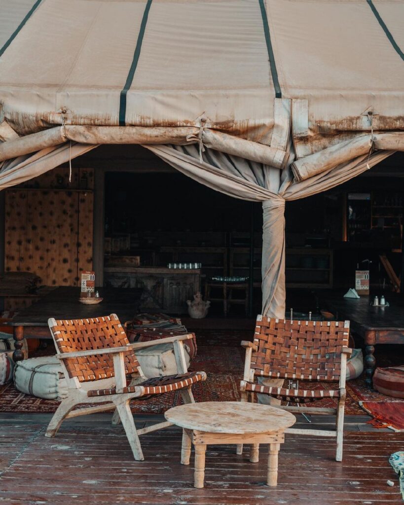 towering cliffs, Agafay Desert, Marrakech, Scenic view of golden sand dunes and barren landscape in Agafay Desert, Morocco.