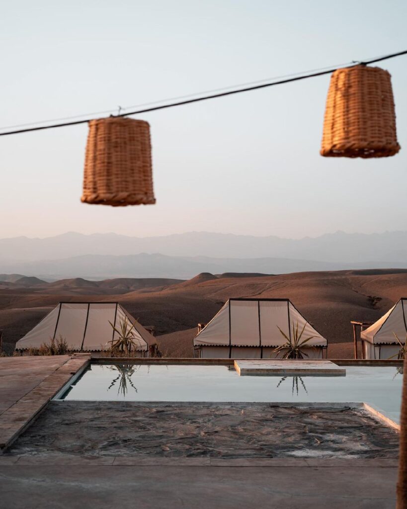 Agafay desert, towering cliffs, Agafay Desert, Marrakech, Scenic view of golden sand dunes and barren landscape in Agafay Desert, Morocco.