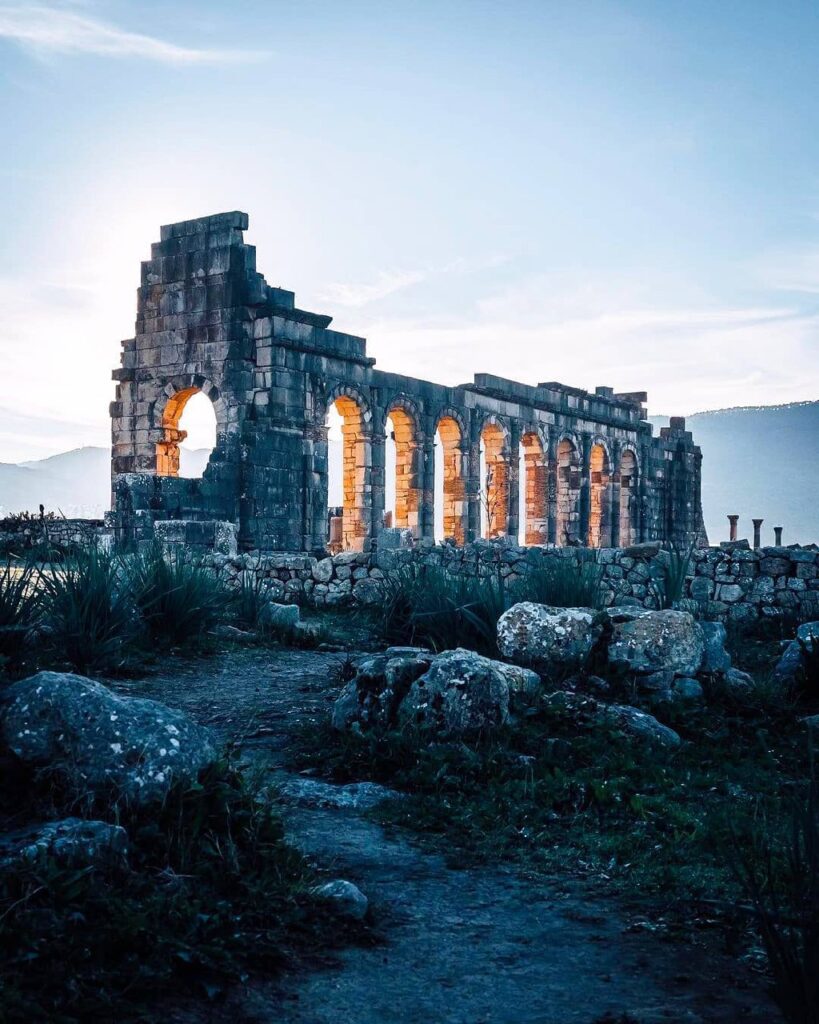Arch of Caracalla, Volubilis, View of ancient Roman ruins and intricate mosaics at Volubilis, Morocco.